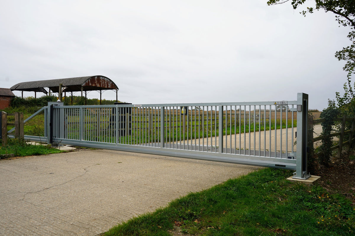 Galvanised cantilever sliding gate across a site entrance
