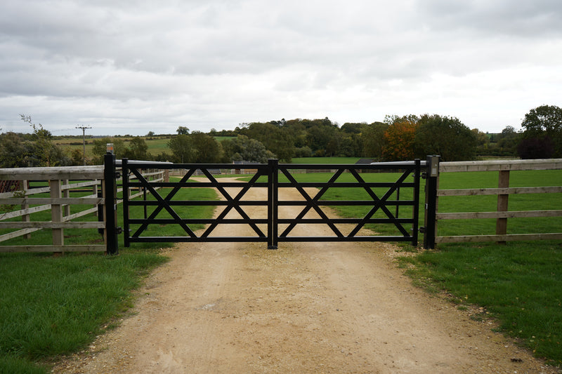 EstateGuard five-bar style automated double swing gates across a rural track
