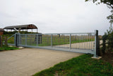 Galvanised cantilever sliding gate across a site entrance