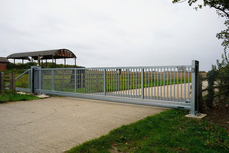 Galvanised cantilever sliding gate across a site entrance